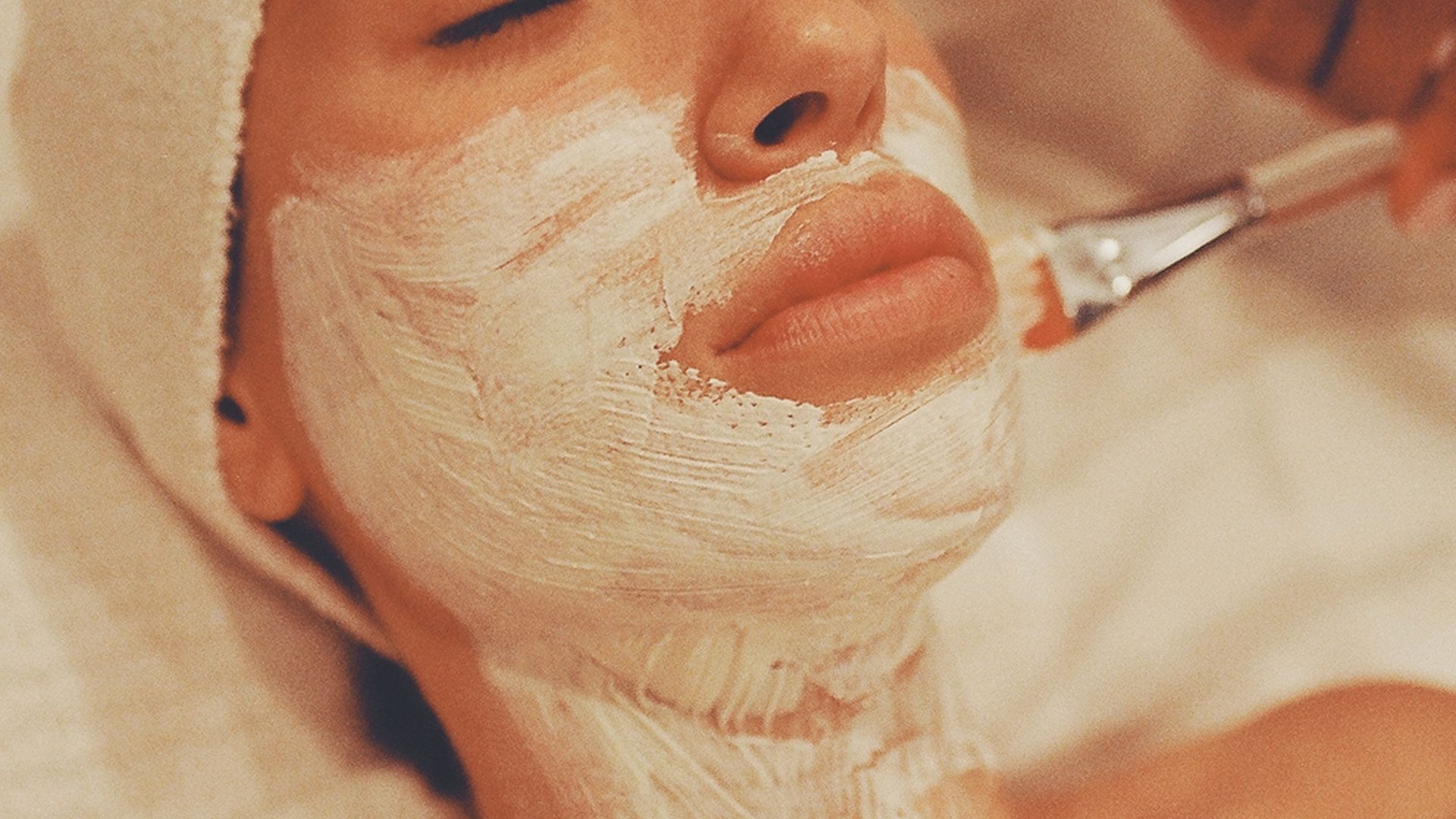 Relaxing facial mask application at spa